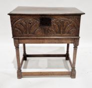17th century oak bible box with single panel hinged lid and lunette carved sides, raised on a