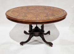 Victorian walnut oval tilt-top centre/loo table, the quarter veneered top inlaid with a band of