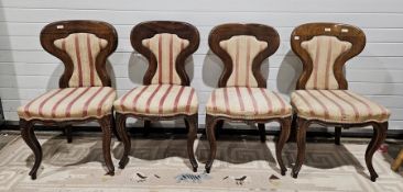 Set of four Victorian rosewood dining chairs, the shaped back with upholstered padded panels and