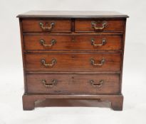 George III mahogany and cross banded chest of two short over three long graduating drawers with