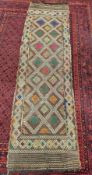 Afghan brown runner of diamond design in green, pink, gold, cream, lime and orange, 250cm x 70cm