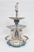 Late 19th century French porcelain centrepiece, three-tiered with white bisque figural finial,