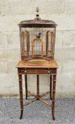Theodore Alexander hardwood side table, the top with an attached birdcage of circular form having
