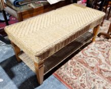 Modern wicker conservatory two-tier coffee table raised on square tapering wooden legs, 111cm long x