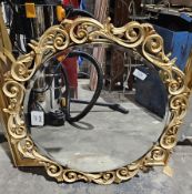 Mid 20th century ' Atsonea ' circular bevelled edge mirror with a scrolling pierced cream and gilt