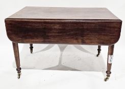 19th century mahogany pembroke table with drawer to one end and raised on turned legs terminating in
