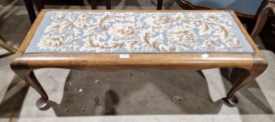 Early 20th century walnut-framed long stool with inset needlework panel to top and raised on