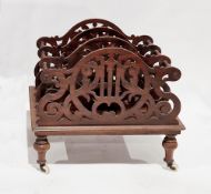 19th century mahogany four-section canterbury, the scrolling pierced panels united by turned
