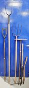 Six antique agricultural instruments including Whitehouse billhook with hedgehog trade mark on