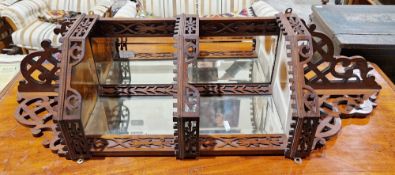 19th century walnut hanging corner shelf with pierced fretwork and blind fretwork carving and
