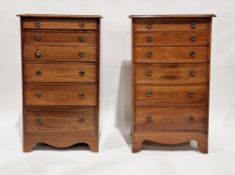 Pair of rosewood chests of six graduated long drawers, each with brass drop ring handles, with