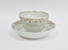 Lowestoft white and gilt ogee-shaped teabowl and saucer, circa 1790, gilt with scattered sprigs