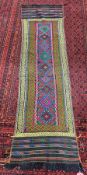 Handmade runner, Afghan(?), multi-coloured with red, green, pink, indigo and yellow centre panel