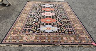 Very large Iranian rug with centre panels in turquoise, yellow and rust on dark background, with