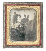 Victorian daguerreotype photograph of a group of nine people abroad an open motorised vehicle, later
