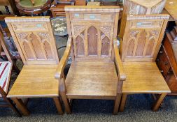 Set of three pale oak Gothic Revival chairs including one carver, the solid backs with moulded