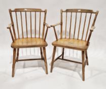 Pair of early to mid 20th century beechwood stickback elbow chairs retailed by P E Gain Ltd of