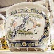 Oversized ceramic jardiniere decorated with cranes and crysanthemums