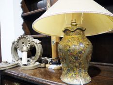 Table lamp, floral decorated, a wooden table lamp with a crest and a pair of wall sconces in