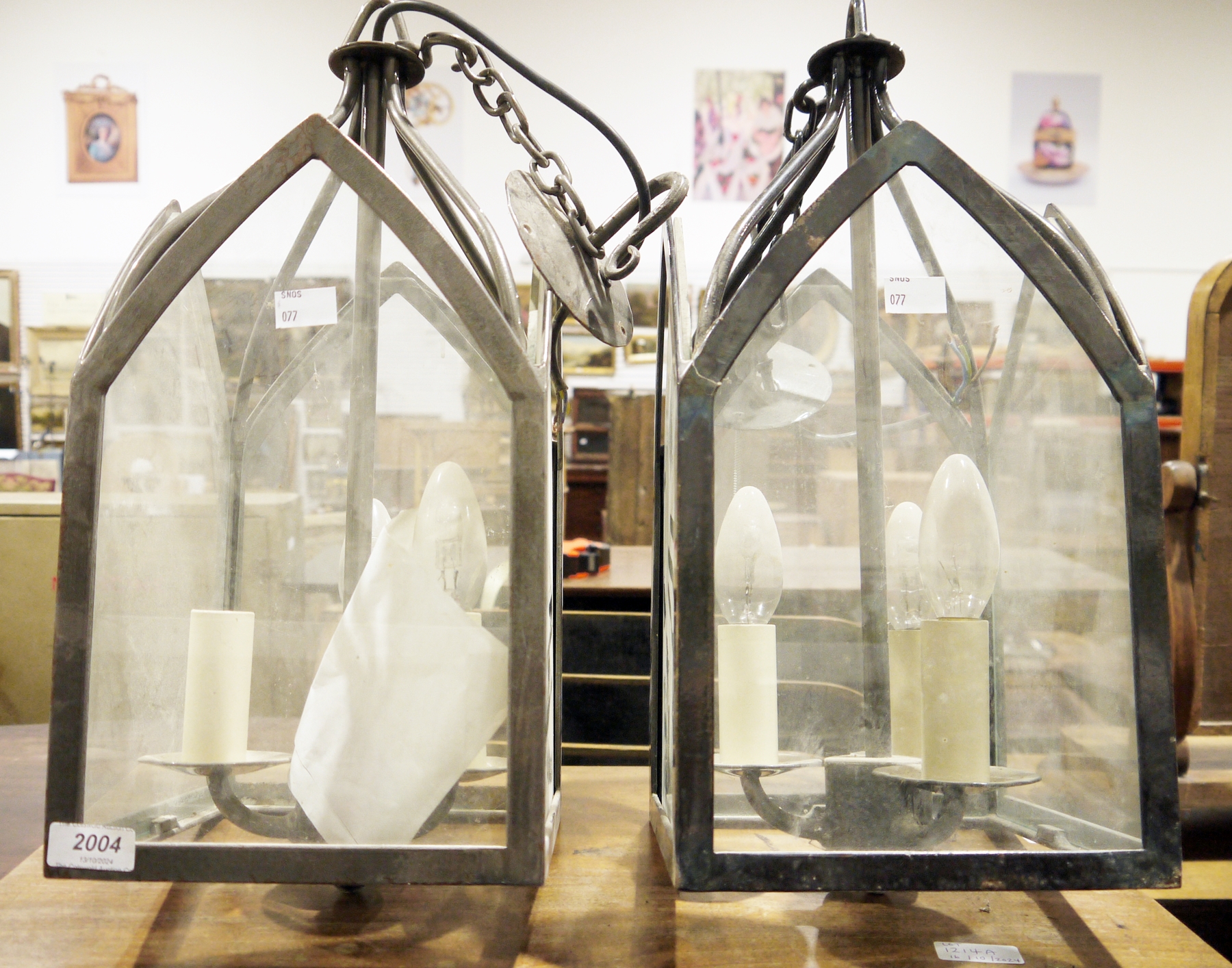 Pair of metal and glass lanterns, electrified for three candle light bulbs, with ceiling rose and