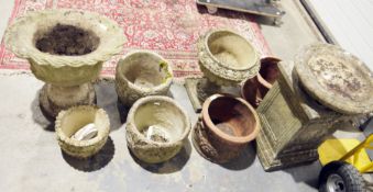 Seven assorted garden planters in terracotta and reconstituted stone, a square-section stand and
