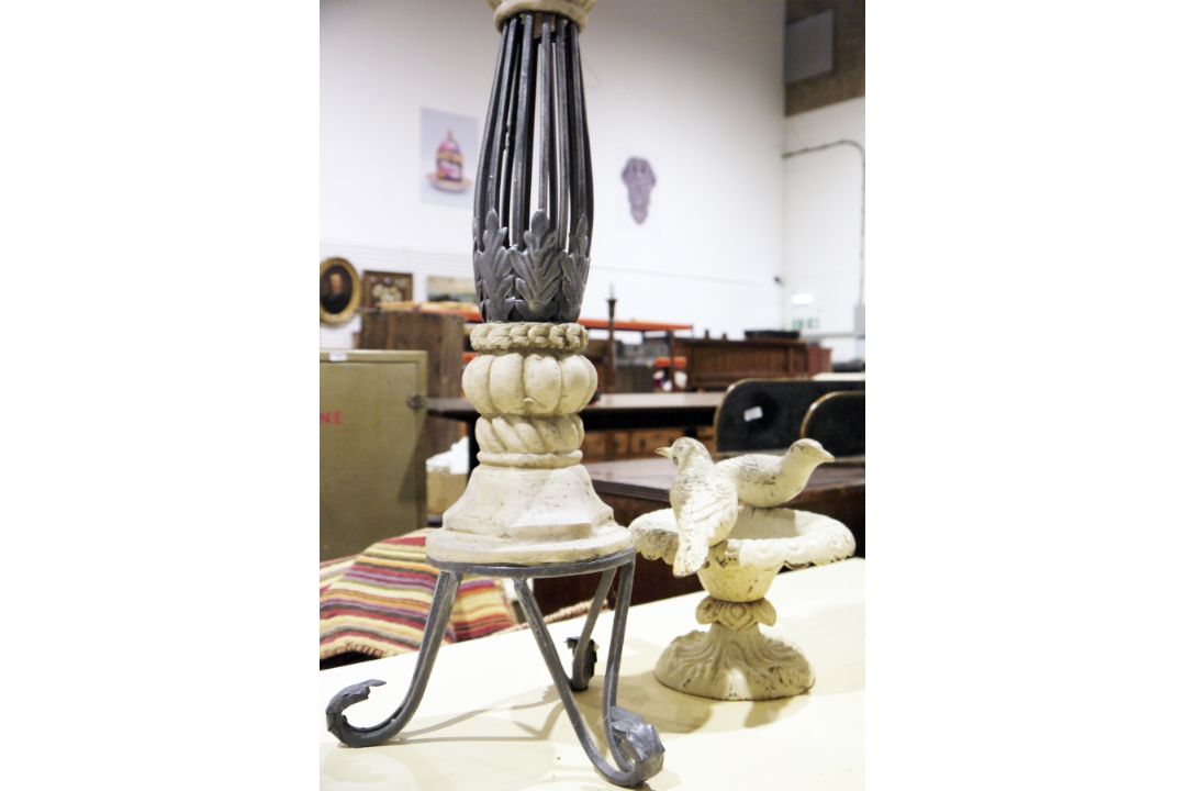 Cast metal small bird bath surmounted by two birds, 23cm high together with modern tall candle