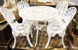 Ornate metal circular garden table and four chairs with oval back, white painted finish, table
