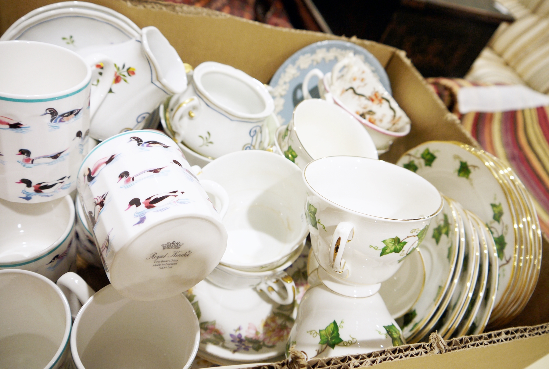 Colclough part tea service with ivy decoration on a white ground and Royal Kendall bone china mugs