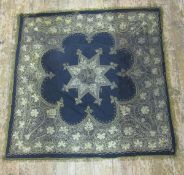Early 20th century Indian gold thread embroidery on black wool ground with gilt thread fringe,