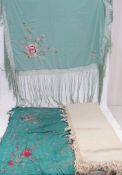 A large wool cream embroidered shawl with a woollen fringe (some stains), a Chinese green silk shawl