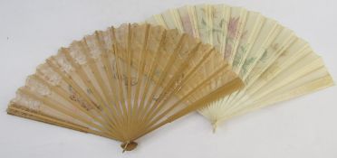 Two late 19th century painted silk folding fans, the first painted with pink and orange flowers on