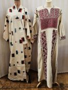 A modern Japanese silk kimono printed in block colours of red and black and blue and black and an