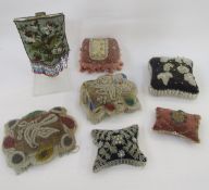 Six Victorian beadwork pincushions and the front panel from a beadwork offertory bag, including a