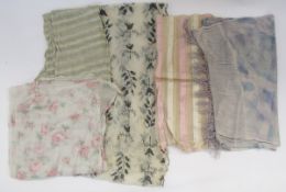 A late 19th century net shawl embroidered with black detail flowers, scalloped edge in black, a pink