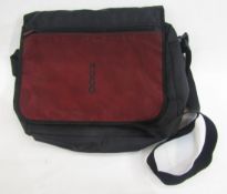 A Hugo Boss nylon messenger bag with front zip flap velcro fastening and Hugo printed on the front