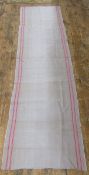 A length of French ticking, grey with a red stripe, 76 cm w. x 276 cm length