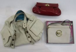 A Michael Kors cream leather bag with two compartments, zip fastening, shoulder strap, gilt hardware