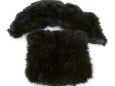 A black swansdown short shoulder cape/collar with matching muff, an ostrich feather boa in cream and