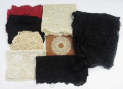 Collection of vintage lace shawls and lace fragments, in cream, red and black, together with a