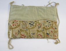 18th century crewel work panel later mounted on a silk cushion cover, of rectangular form, worked