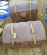 Two vintage domed travelling trunks, both with leather straps and fitted trays, one 71cm x 51cm