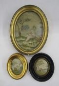 Three mid 19th century framed oval silk embroidered pictures, the first with a garlanded girl seated
