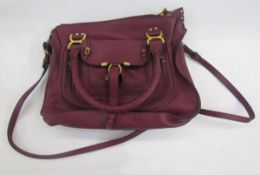 Chloe plumb leather bag with saddle stitching, pierced decoration, the fastening to the front flap a