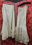 Victorian petticoats and a pinny, to include a petticoat with lace panels and ribbon threaded