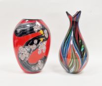 Large art glass vase of flattened ovoid form with multi-coloured swirls on red ground, possibly