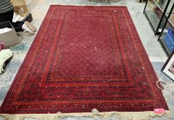 Persian style red ground floral rug with centre piece design, multiple geometric borers with red,