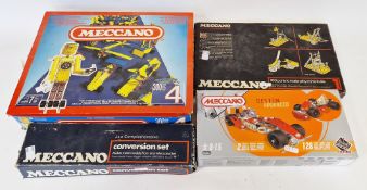 Four boxed Meccano sets including Meccano conversion set 2X, Meccano design advanced set no. 84