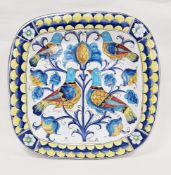 Italian pottery large charger, rounded square and decorated in bright polychrome colours with
