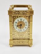 Brass five-glass carriage clock in elaborately decorated brass case with pierced filigree panels,