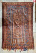 Afghan prayer rug with four central medallions in blue and coral with geometric borders in blue, red